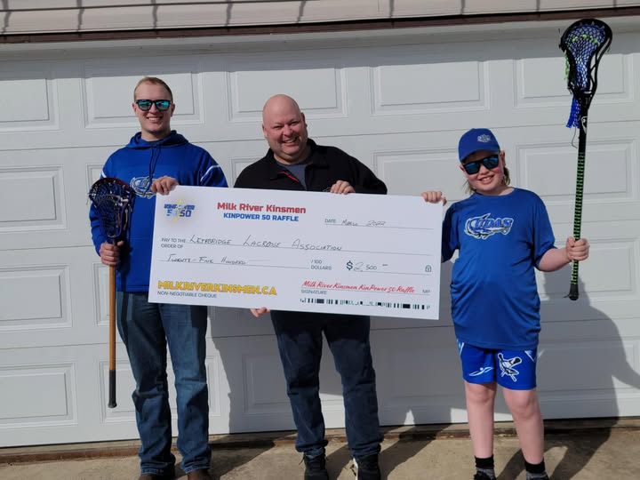 Milk River Kinsmen volunteers present a KinPower 50/50 Raffle cheque to the Lethbridge Lacrosse Association